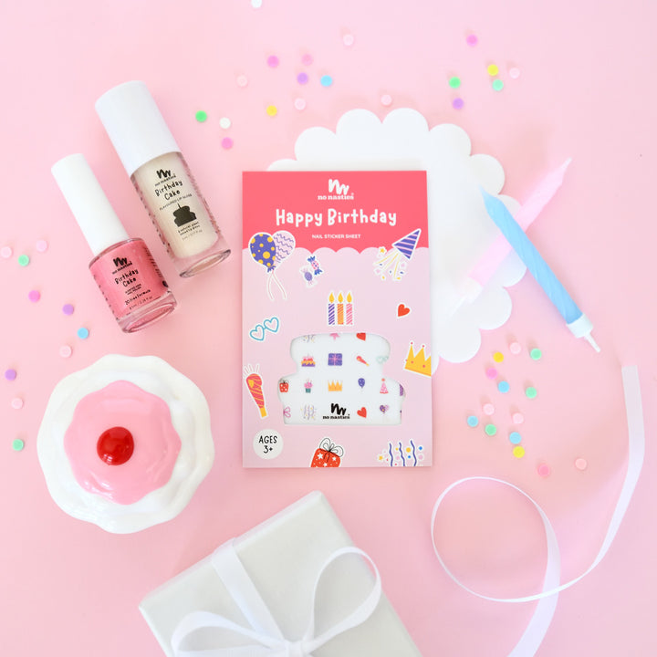 Pink birthday-themed play makeup set with nail polish, stickers, and lipgloss for kids.